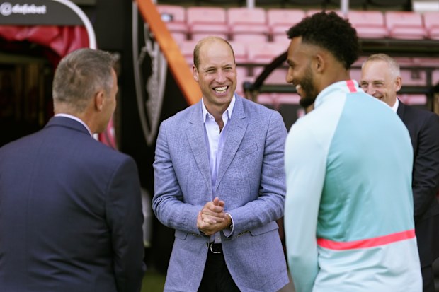 Prince William, Prince of Wales (centre) during a visit to Bournemouth AFC's Vitality Stadium in Dorset 