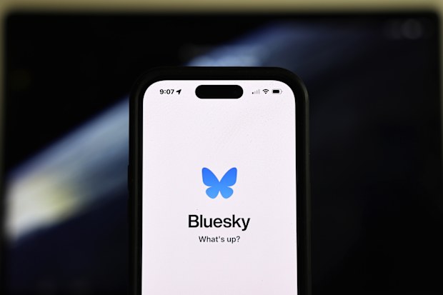 PASADENA, CALIFORNIA - NOVEMBER 14: In this photo illustration, the Bluesky logo is displayed on a cell phone on November 14, 2024 in Pasadena, California. The social media app Bluesky has seen its user base increase by 1.25 million since the U.S. Presidential elections as some people leave rival X, which is owned by Elon Musk. (Photo Illustration by Mario Tama/Getty Images)