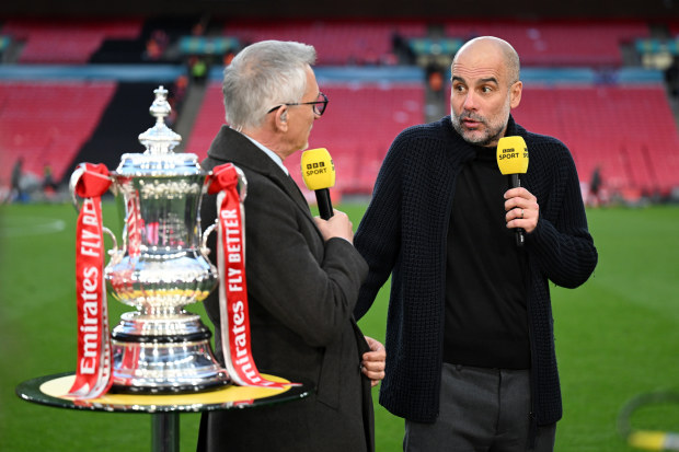 Gary Lineker speaks to Pep Guardiola after Manchester City's victory.