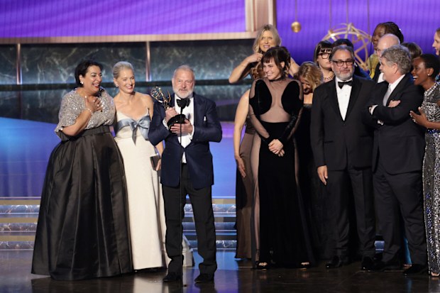 Los Angeles, CA   September 14, 2025  John Wells accepts the award for outstanding drama series for The Pitt during the show at the 77th Primetime Emmy Awards at the Peacock Theater in Los Angeles, CA, Sunday, Sept. 14, 2025. (Myung J. Chun / Los Angeles Times)