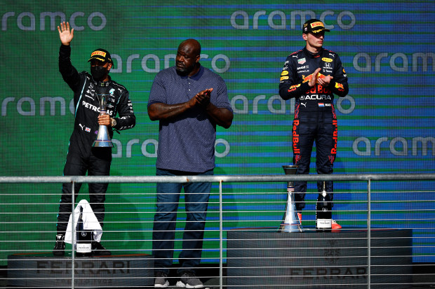 NBA legend Shaquille O'Neal on the podium with Lewis Hamilton (left) and Max Verstappen at the US Grand Prix.