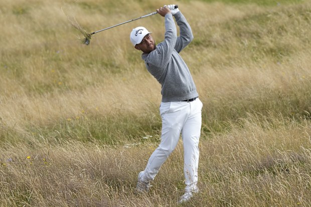Xander Schauffele of the United States plays from the rough on the 15th hole during a practice round ahead of the British Open Golf Championships at Royal Troon golf club in Troon, Scotland, Wednesday, July 17, 2024. (AP Photo/Jon Super)