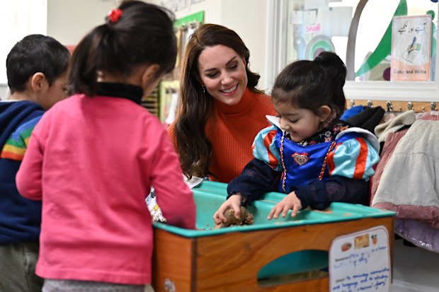 LUTON, ENGLAND - JANUARY 18: Catherine, Princess of Wales interacts with children playing in a sandpit during her visit to Foxcubs Nursery on January 18, 2023 in Luton, England. The Princess of Wales's visit is part of her work highlighting the importance of early childhood development. (Photo by Justin Tallis - WPA Pool/Getty Images)