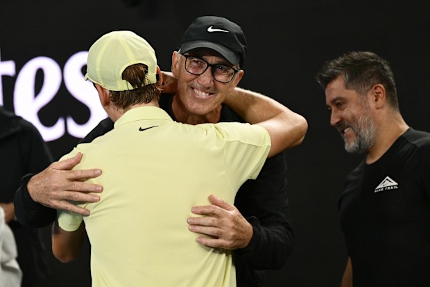 Jannik Sinner and Darren Cahill embrace after the Italian's 2025 Australian Open final triumph.