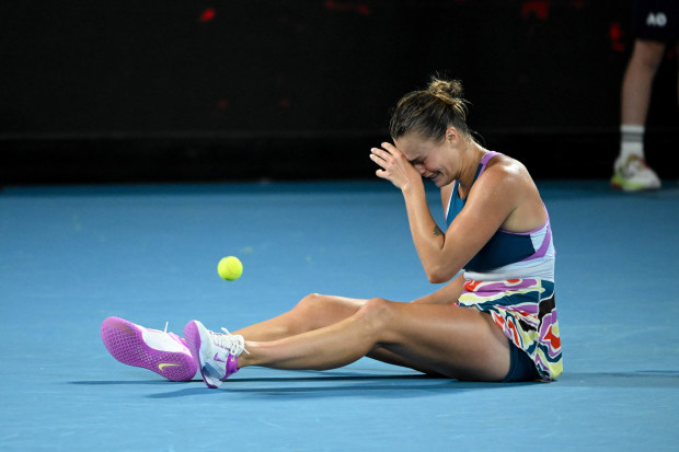 Aryna Sabalenka collapses after winning the Australian Open on Rod Laver Arena.