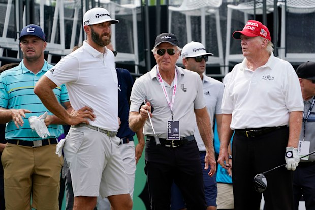 Dustin Johnson, Greg Norman and Donald Trump at the pro-am of a LIV Golf tournament.