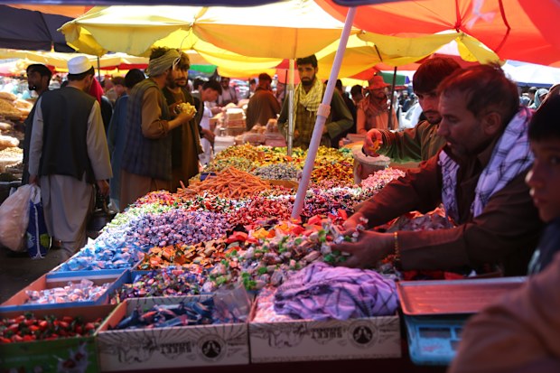 People buy sweets at a local market ahead of Eid al-Adha in Kabul, capital of Afghanistan, June 3, 2025. TO GO WITH "Feature: Afghans struggle to mark Eid al-Adha amid U.S. sanctions" (Photo by Saifurahman Safi/Xinhua via Getty Images)