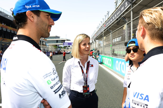 Susie Wolff (middle) managing director of F1 Academy talks with Daniel Ricciardo, Yuki Tsunoda, and Liam Lawson.