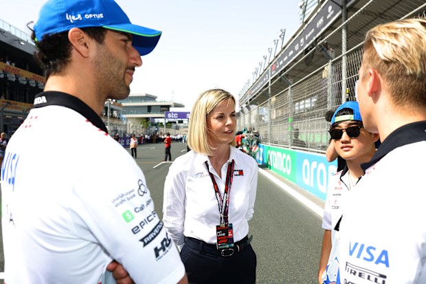 Susie Wolff (middle) managing director of F1 Academy talks with Daniel Ricciardo, Yuki Tsunoda, and Liam Lawson.