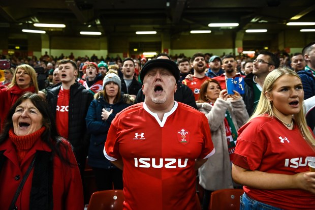 Wales supporters sing the national anthem before the Guinness Six Nations Rugby Championship match between Wales and Ireland at Principality Stadium.