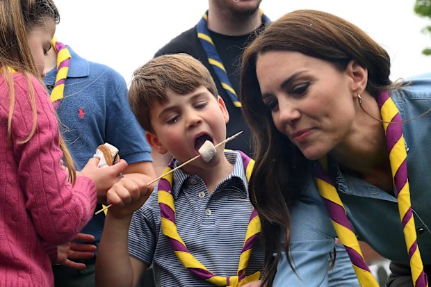 Prince Louis of Wales and Catherine, Princess of Wales toast marshmallows as they take part in the Big Help Out, during a visit to the 3rd Upton Scouts Hut in Slough on May 8, 2023