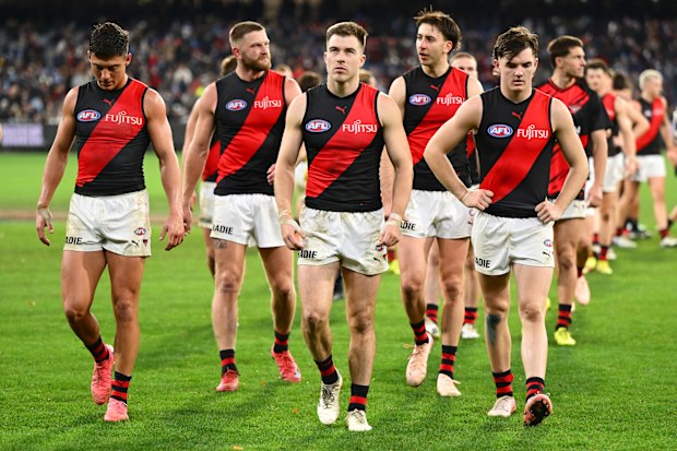 Essendon players leave the ground following their loss to Carlton earlier in the season.