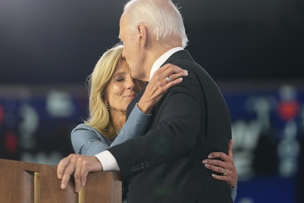 President Joe Biden hugs First Lady Jill Biden during the Democratic National Convention Monday, Aug. 19, 2024, in Chicago. (AP Photo/Paul Sancya)