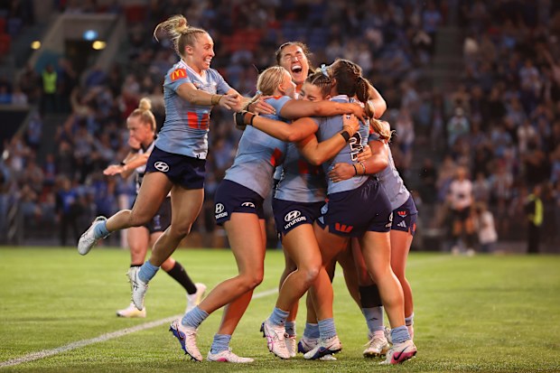 NEWCASTLE, AUSTRALIA - APRIL 30: Jessica Sergis of the Blues celebrates a try with teammates during game one of the Women's State of Origin series between New South Wales Blues and Queensland Maroons at McDonald Jones Stadium on April 30, 2026 in Newcastle, Australia. (Photo by Scott Gardiner/Getty Images)