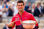 Novak Djokovic of Serbia celebrates with the winners trophy as he points to the number 23 on his jacket after victory against Casper Ruud of Norway in the Men's Singles Final match on Day Fifteen of the 2023 French Open at Roland Garros on June 11, 2023 in Paris, France. (Photo by Julian Finney/Getty Images)