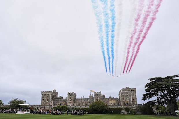 Red Arrows fly past