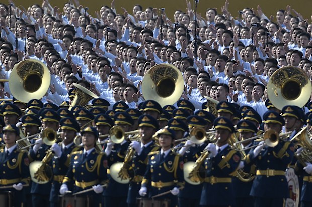BEIJING, CHINA - SEPTEMBER 03: A military band and choir perform before the military parade marking the 80th anniversary of victory over Japan and the end of World War II, in Tiananmen Square on September 03, 2025, in Beijing, China. China's Victory Day military parade serves as a powerful display of national pride and military power. This year's parade carries heightened geopolitical weight with the attendance of leaders like Vladimir Putin, Kim Jong Un and Narendra Modi, underlining China's di