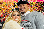 Quarterback Patrick Mahomes #15 of the Kansas City Chiefs poses for a photo with his wife Brittany Mahomes after the AFC Championship game against the Buffalo Bills, at GEHA Field at Arrowhead Stadium on January 26, 2025 in Kansas City, Missouri.