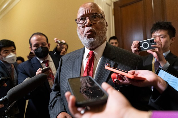 Chairman of the House select committee investigating the Jan. 6, 2021, attack on the Capitol, Rep. Bennie Thompson, D-Miss., is reflected in a cell phone as he talks with the media after a hearing of the committee, Thursday, June 16, 2022, on Capitol Hill in Washington. (AP Photo/Jacquelyn Martin)