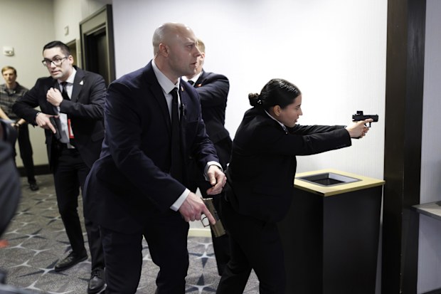 Members of law enforcement respond during the White House Correspondents Dinner shooting.