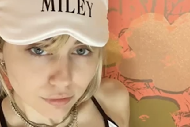 Miley Cyrus poses in a customised Shhh Silk eye mask.