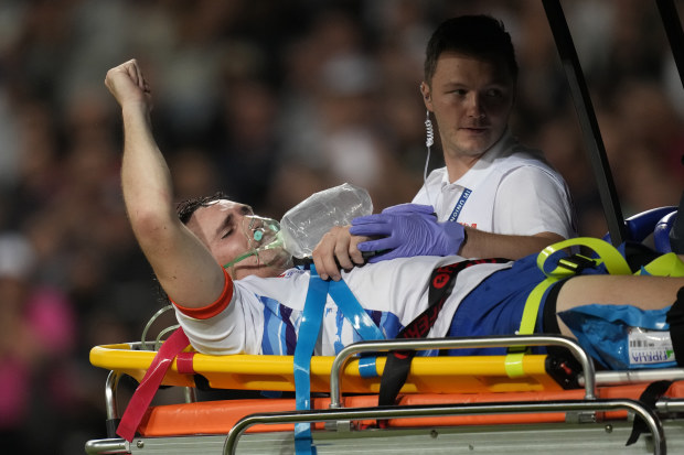 Le Roux Malan is taken off the field on a stretcher after getting injured during the Rugby World Cup Pool A match between New Zealand and Namibia.