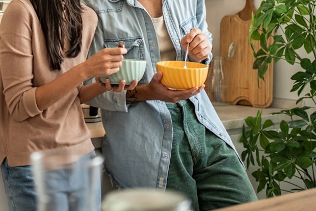 couple splitting costs moving in together