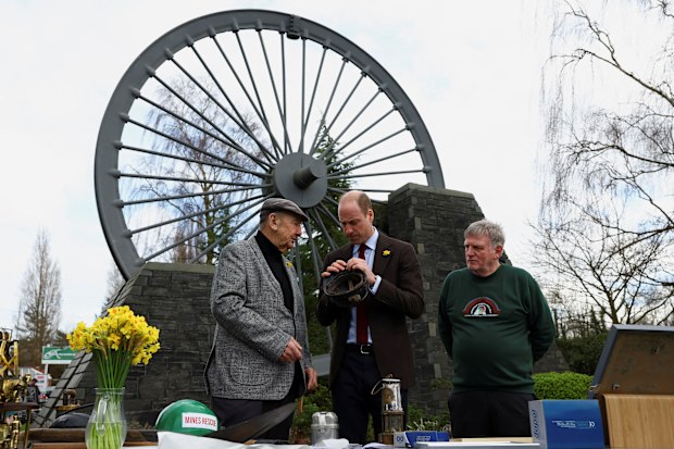 Prince William, Prince Of Wales is accompanied by Alan Jones chairman of Gresford disaster memorial and George Powell, lead volunteer at the Wrexham Miners Project, during a visit to the Gresford Colliery Disaster memorial on March 1, 2024 in Wrexham, Wales.  