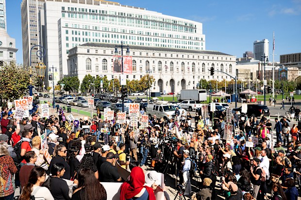 Protesters against U.S. Immigration and Customs Enforcement rally outside city hall on Thursday, Oct. 23, 2025, in San Francisco. (AP Photo/Noah Berger)