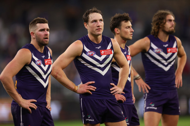 PERTH, AUSTRALIA - APRIL 21: Luke Ryan, Brennan Cox, Ethan Hughes and Luke Jackson of the Dockers look on after being defeated during the round six AFL match between Fremantle Dockers and Western Bulldogs at Optus Stadium, on April 21, 2023, in Perth, Australia. (Photo by Paul Kane/Getty Images)