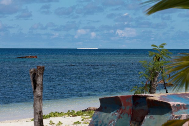 In photo, a sandbar, sits on the horizon off the Philippine-claimed Thitu Island in the disputed South China Sea in western Philippines, April 21, 2017.