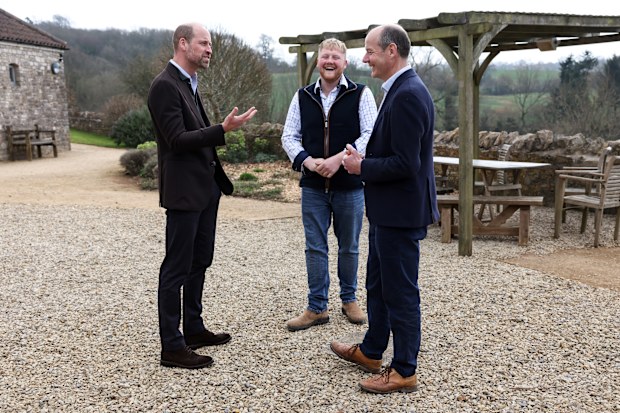 PENSFORD, ENGLAND - MARCH 26: Prince William, Prince of Wales (L) speaks with Clarkson's Farm stars Kaleb Cooper (C) and Charlie Ireland (R) during an event for sixty of the Duchy of Cornwall's next generation of farming tenants, on March 26, 2025 in Pensford, England (Photo Darren Staples - WPA Pool/Getty Images)