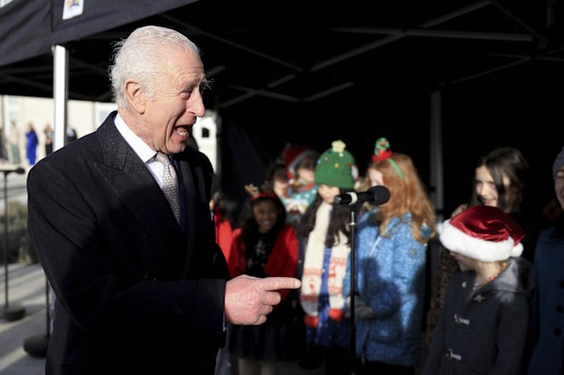 Britain's King Charles attends a reception at Waltham Forest Town Hall in London, Friday, Dec. 20, 2024. (Mina Kim/Pool Photo via AP)