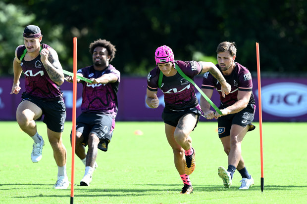 Reece Walsh competes in a training drill during a Broncos training session. (Photo by Bradley Kanaris/Getty Images)