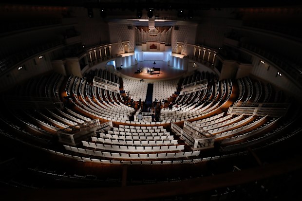 Russian pianist Denis Matsuyev plays piano on a stage of Tchaikovsky Concert Hall while preparing for online live during a rehearsal in Moscow.