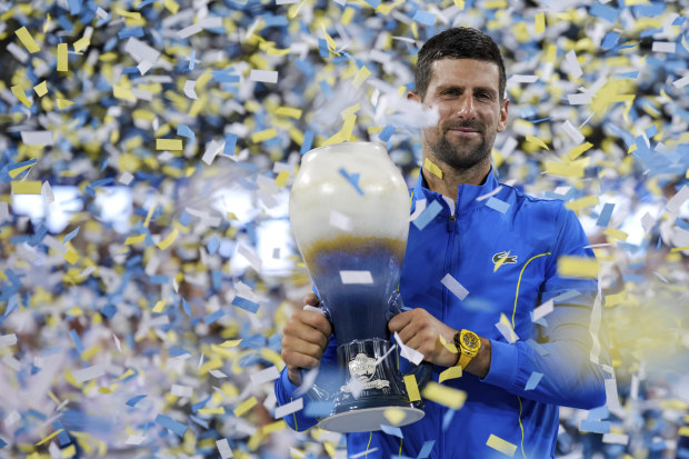 Novak Djokovic, of Serbia, celebrates with the Rookwood Cup after defeating Carlos Alcaraz at the Cincinnati Open.