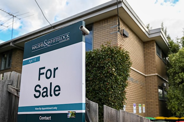 A for sale sign on a home.