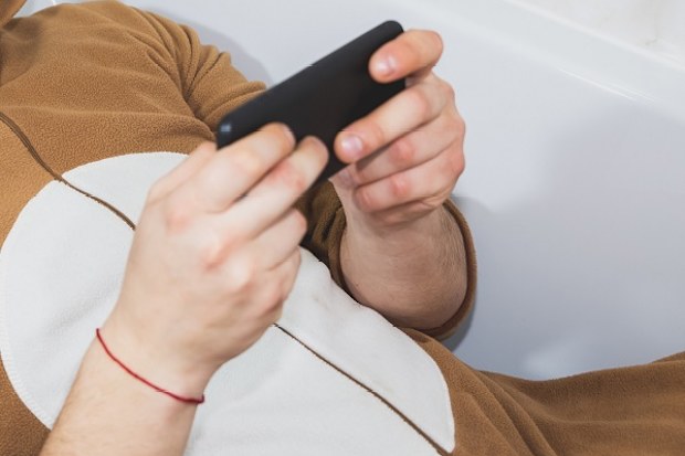 man watching videos on phone