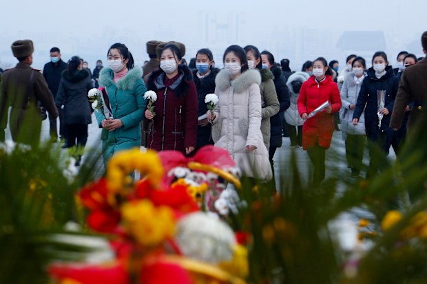 Citizens visit the statues of President Kim Il Sung and Chairman Kim Jong Il on Mansu Hill