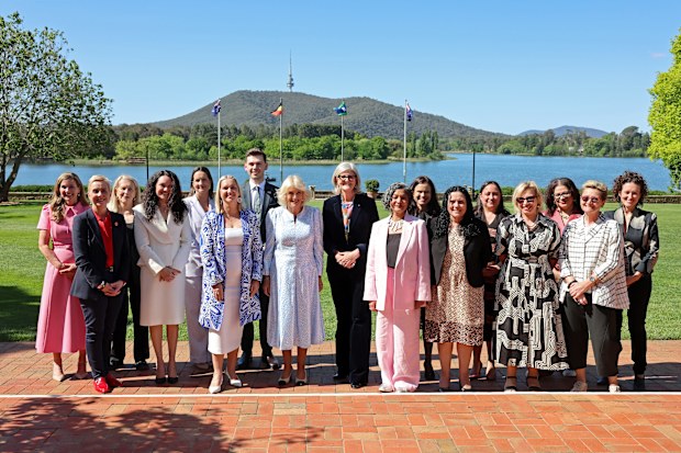 Queen Camilla, The Governor-General of the Commonwealth of Australia, Her Excellency the Honourable Ms Sam Mostyn and GIVIT staff and volunteers pose for a group picture outside Banksia Centre at Australian National Botanic Gardens on October 21, 2024 in Canberra