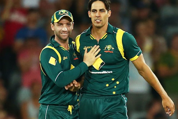 Phil Hughes and Mitchell Johnson. (Getty)