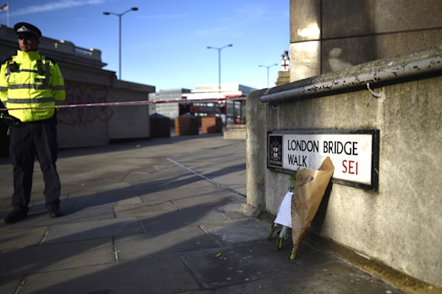 Flowers rest against a wall at the scene of the London Bridge stabbing attack. A man and a woman were killed and three seriously injured during the  stabbing attack. The suspect was shot dead by Police officers after members of the public restrained him.