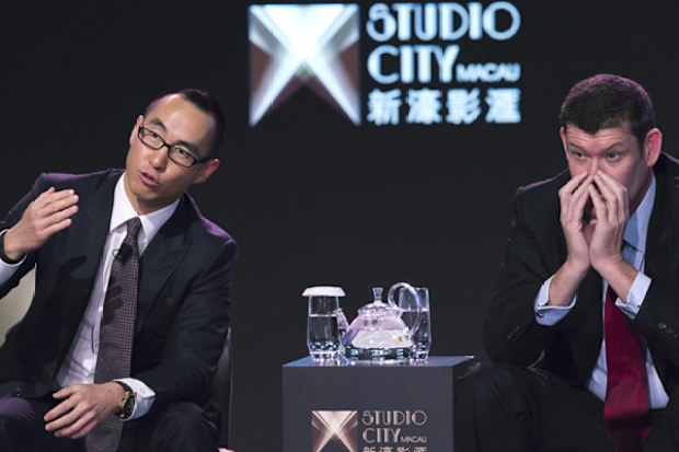 Melco Crown Entertainment co-chairman and chief executive officer Lawrence Ho, left, speaks in 2015 as co-chairman James Packer listens during a news conference about the Studio City project in Macau.