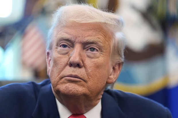 President Donald Trump listens during an event in the Oval Office to mark the 90th anniversary of the Social Security Act, Thursday, Aug. 14, 2025, in Washington. (AP Photo/Alex Brandon)