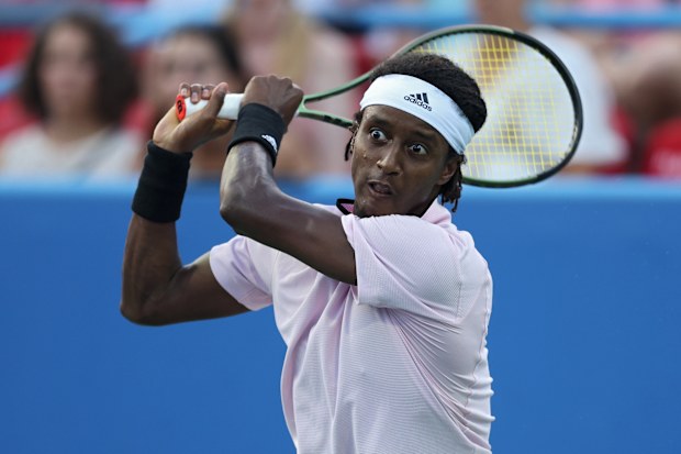 Mikael Ymer of Sweden returns a shot to Nick Kyrgios of Australia in the Men's Semifinal during Day 8 of the Citi Open at Rock Creek Tennis Center on August 6, 2022 in Washington, DC. (Photo by Patrick Smith/Getty Images)