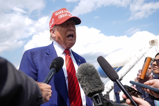 President Donald Trump speaks with reporters upon arriving at Morristown Municipal Airport in Morristown, N.J., Friday, June 20, 2025. (AP Photo/Manuel Balce Ceneta)
