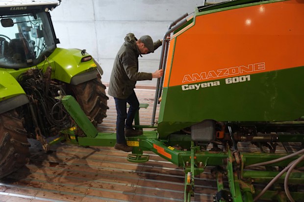 HEREFORD, ENGLAND - JANUARY 28: Prince William, Prince of Wales being shown a seed drill during a visit to Lower Blakemere Farm, a Duchy Focus Farm in Hereford, to learn more about how the multigenerational farm has refined regenerative farming practices and farm diversification as part of its journey to net zero on January 28, 2025 in Hereford, England.  Lower Blakemere Farm is one of the Duchy of Cornwall's seven Focus Farms, an initiative designed to share knowledge and experiences of the tra