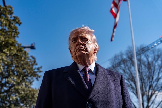 President Donald Trump speaks to reporters before departing on Marine One from the South Lawn of the White House, Friday, Feb. 27, 2026, in Washington. (AP Photo/Alex Brandon)