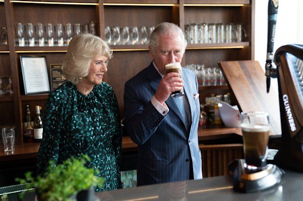 The Prince of Wales sips Guinness during a visit with Camilla, Duchess of Cornwall to the Irish Cultural Centre to celebrate the Centre's 25th anniversary in the run-up to St Patrick's Day 