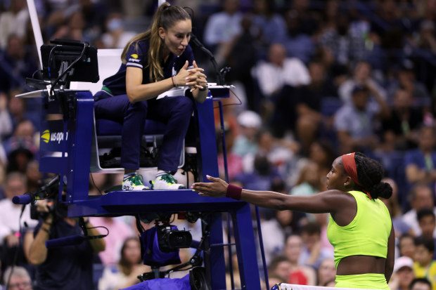 Coco Gauff of the United States speaks to the chair umpire after a point against Laura Siegemund of Germany.